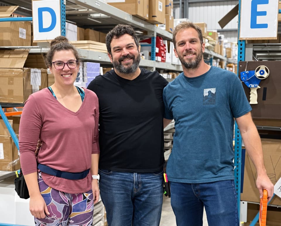 Ariane Bellemare, Simon Côté and Jonathan St-Denis in a warehouse aisle
